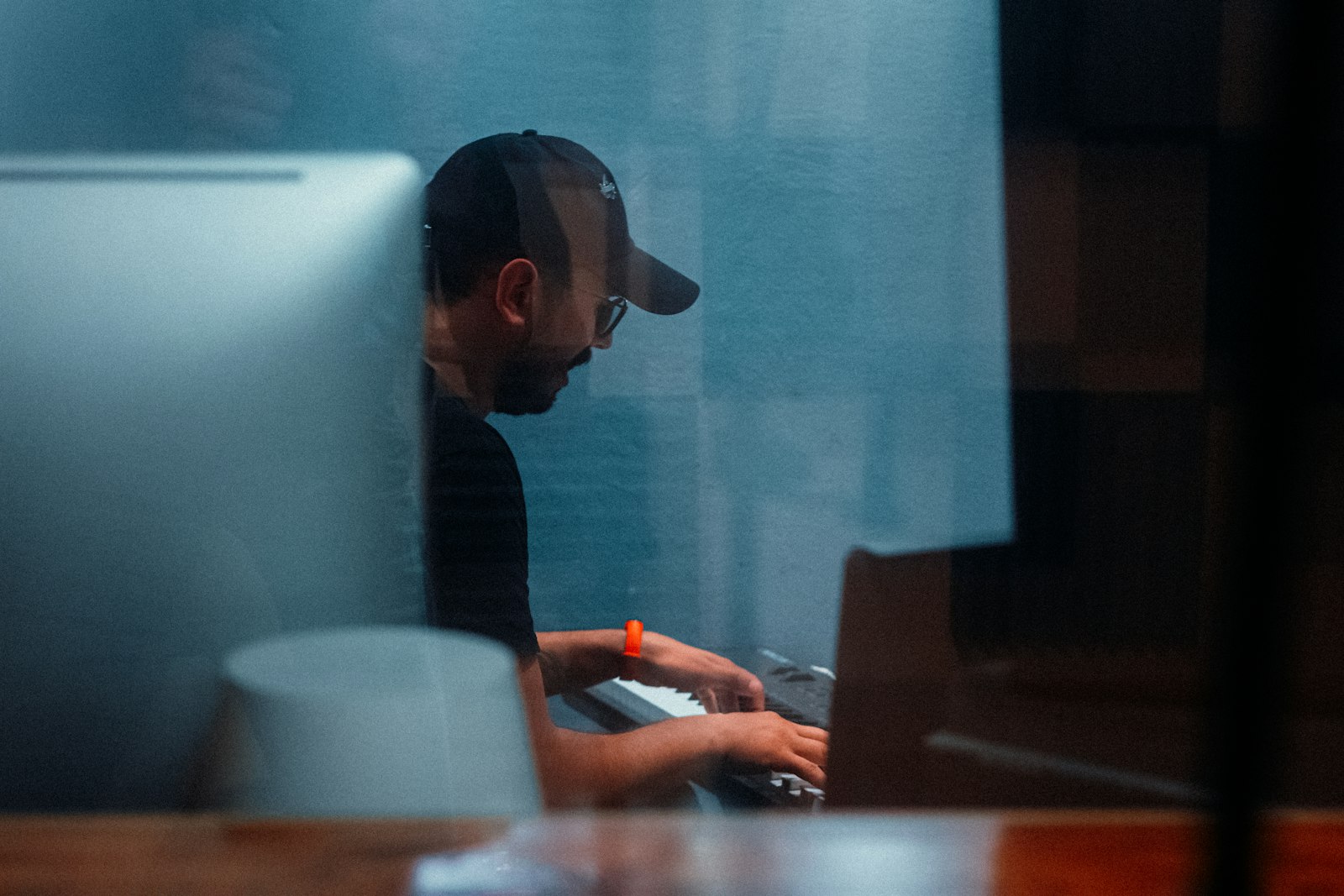 An SEO specialist working at a desk in a studio